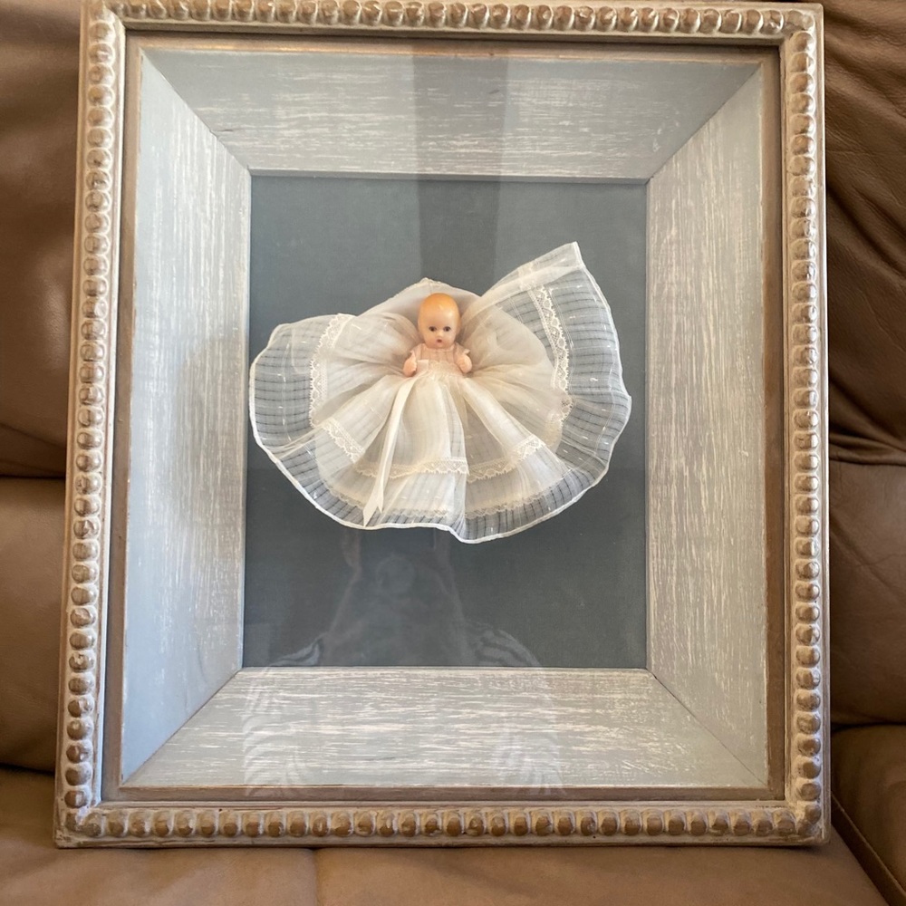 Artwork, vintage doll in washed grey frame